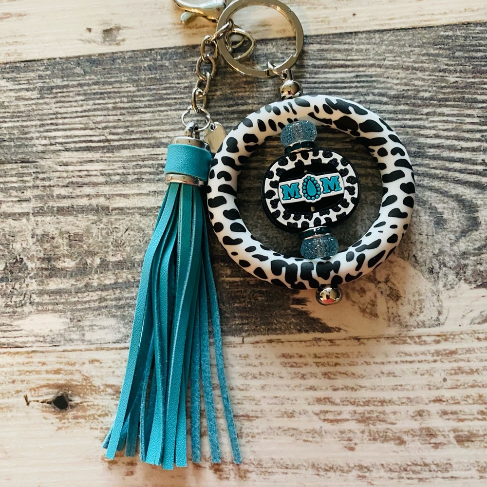 Stylish Black and White Key Holder with Blue Tassel